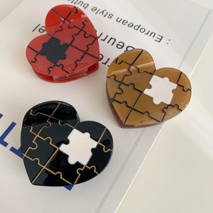 Chic heart-shaped acetate hair claw clips with creative puzzle pattern in three colors
