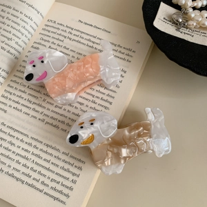 Cute acetate dog-shaped hair claws in orange and brown with elegant pearly texture