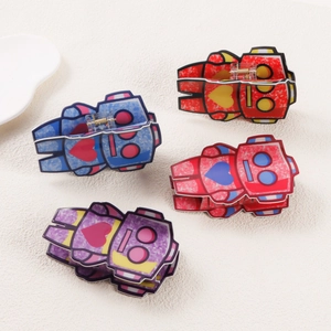 Set of four colorful cartoon robot hair clips with glitter texture and heart details