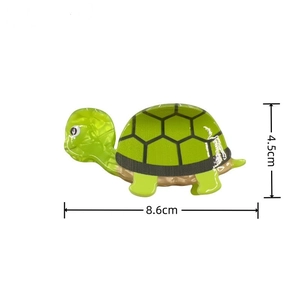 Detail view of the green sea turtle hair claw clip showing size dimensions 8.6cm by 4.5cm