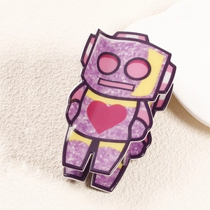 Detail view of the purple floral robot hair claw with a pink heart decoration
