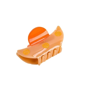 Elegant peach acetate hair claw clip with vintage fan shape and gold coin relief details