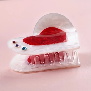 Pearlescent white heart hair claw clip with red heart and colorful rhinestones