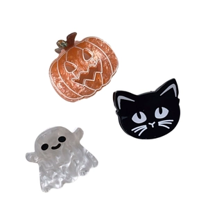 Halloween hair claw clips set featuring orange pumpkin black cat and white ghost shapes