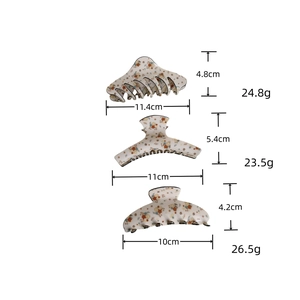 Detailed size and weight guide for three floral hair claws with vintage patterns