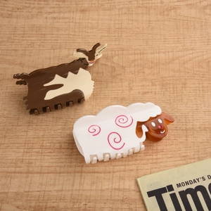 Cute acetate animal hair claws featuring goat and sheep designs in warm earth tones