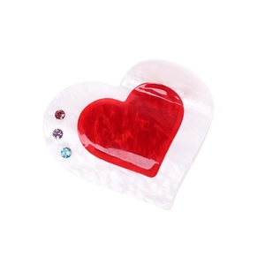Elegant heart-shaped acrylic hair claw with red marble core and colorful rhinestones