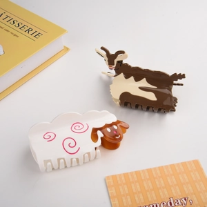 Detail view of acetate goat and sheep hair claws with glossy texture and unique animal patterns