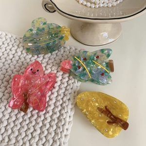 Set of four creative acetate Christmas tree and cactus hair claws with marble texture