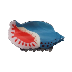Detail view of blue and red shell hair claw clip showing the grip and resin texture
