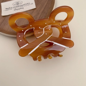 Amber brown acetic acid hair claw clip with hand-painted patterns and pretzel shape