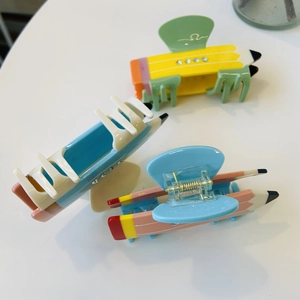 Cute pencil-shaped acetate hair claw clips with colorful rhinestones in three candy colors
