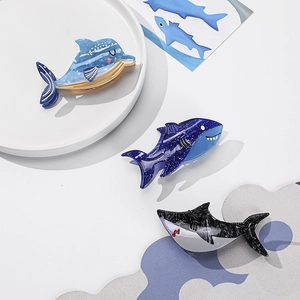 Ocean series hair claw set with blue dolphin and marble shark designs in acetate