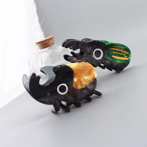 Creative acetate beetle hair claws with marble texture and unique insect design for women