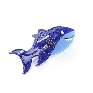 Sparkly blue shark hair claw clip made of acetate with ocean themed design for women