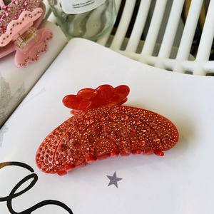 Pince à cheveux rose avec strass brillants et design en résine en forme d'éventail