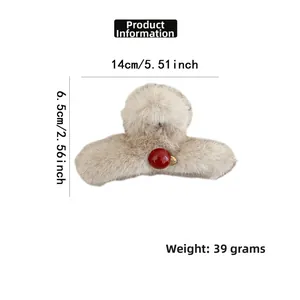 Detailed size specifications of the beige faux fur hair claw clip with red bead accent