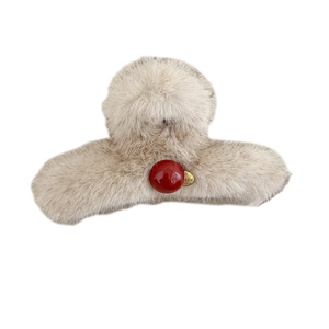 Faux mink fur hair claw clip in beige with a red bead accent and gold pendant