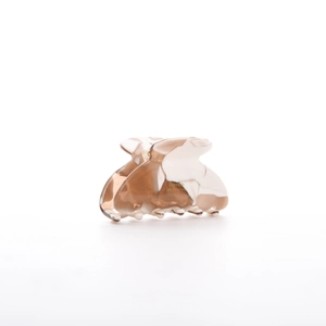 Detail of acetic acid hair claw clip with brown marble pattern and cream white colors