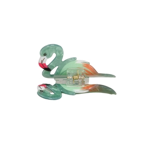 Detail of flamingo claw clip made of marble texture acetate with gold metal spring