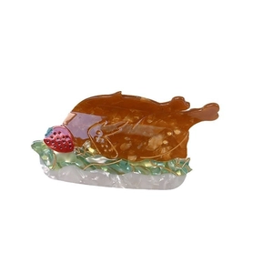 Creative roasted chicken hair claw clip made of amber acetate with strawberry and lettuce details