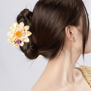 Floral acetate hair claw clip with yellow petals and ladybug detail for women