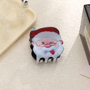 Dettaglio della simpatica molletta per capelli Babbo Natale in acrilico lucido