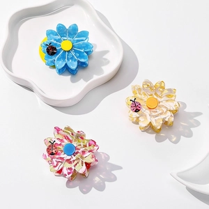 Floral acetate hair claw clip set with ladybug accent in blue and yellow floral colors