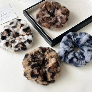 Set of four plush leopard print hair scrunchies in assorted colors for autumn and winter