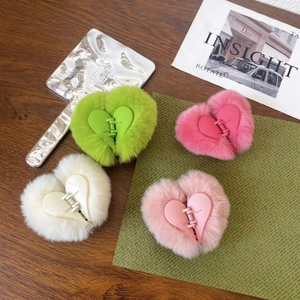 Plush heart-shaped faux fur hair claw clips in assorted vibrant colors for women