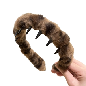 Plush leopard print headband with non-slip teeth for women featuring soft faux fur texture