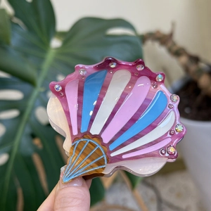 Shell shaped hair claw clip with colorful stripes and sparkling rhinestones for women