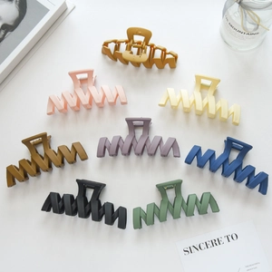 Set of 8 matte large wave claw clips in various colors including yellow, pink, and blue