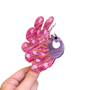 Peacock shaped acetate hair claw clip with purple marble pattern and gold accents