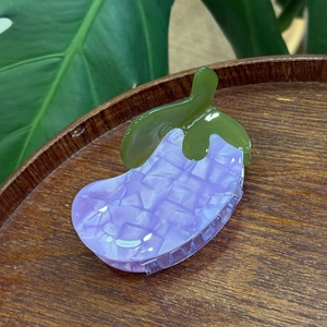 Chic acetate eggplant hair claw clip with purple marble pattern and green leaf design