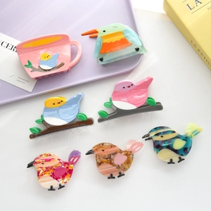 Chic acetate bird-shaped hair claws in vibrant colors and creative animal patterns
