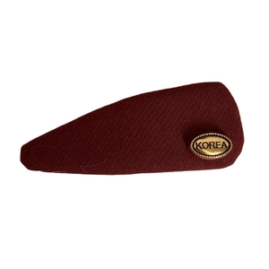 Elegant wine red fabric hair clip with a gold oval metal tag and Korea engraving