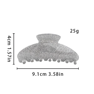 Detail view of silver glitter hair claw clip with 9.1cm length and 25g weight dimensions
