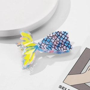 Detailed close-up of a mermaid tail hair claw clip with colorful acetate marble patterns