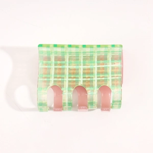 Translucent green plaid hair claw clip with pink inner teeth for stylish hair styling