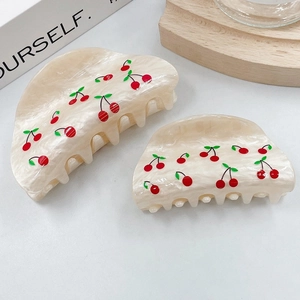 Set of cute cherry print hair claws in milky white with red and green patterns