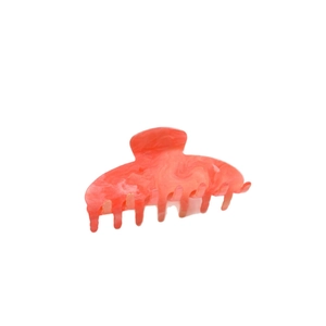Grande pince à cheveux en acrylique orange marbré avec une finition brillante