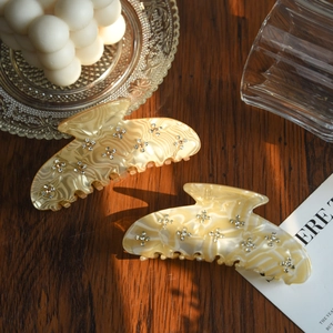 Elegant marble acetate hair claw clips with rhinestone flower patterns for women
