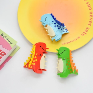 Tres lindas pinzas para el cabello de dinosaurio en azul, rojo y verde para peinados chic