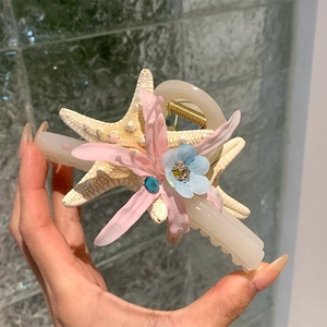 Pince à cheveux série océan avec étoile de mer, pétales de fleurs et strass bleu