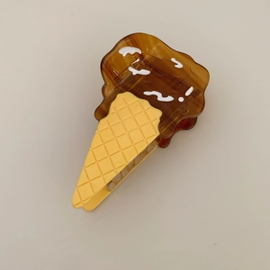 Detailed view of the ice cream cone hair claw clip with chocolate and waffle textures