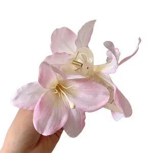 Sweet pink lily flower hair claw clip with realistic 3D fabric petals for women