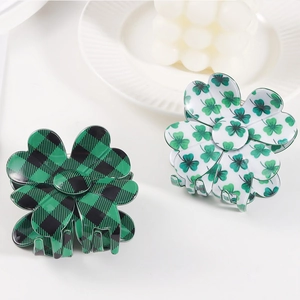 Set of two floral hair claws featuring green plaid and clover patterns on white plate