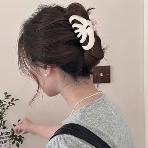 Water ripple bow claw clip in creamy ivory for women's half-up hairstyles