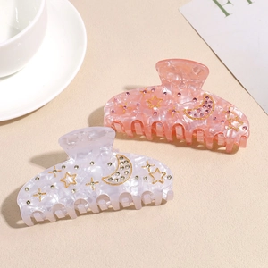 Elegant tortoiseshell hair claws with gold star and moon rhinestones for women